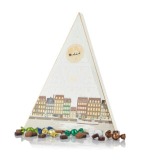 en hvid creme treant julekalender fra cocoture med chokoladekugler i mørk og lys chokolade